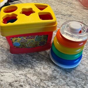 Fisher-Price Red and Yellow Shape Sorter with Multicolored Stacking Rings